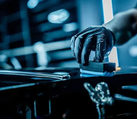Ceramic coating being applied to a car at the System X Car Care workshop in Al Quoz, Dubai, Dubai