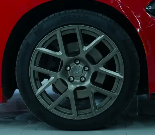 Freshly painted gunmetal alloy wheel at the System X Car Polish workshop in Dubai