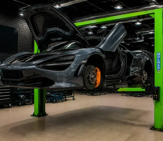 Sports car raised on a lift at the System X Car Polish workshop in Al Quoz, Dubai